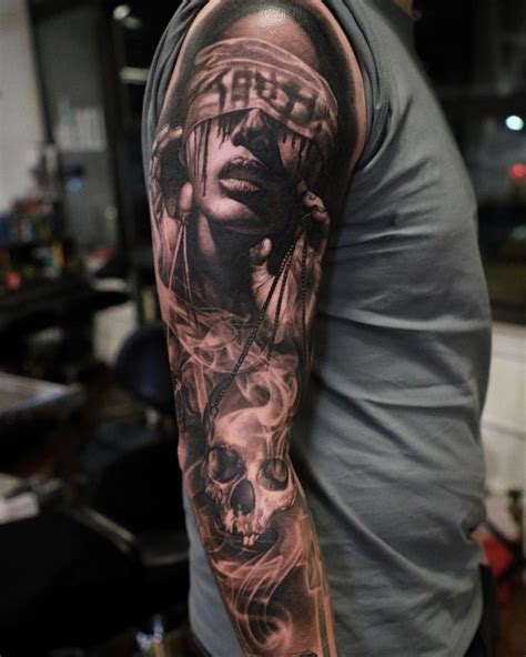 black and grey realism tattoo sleeve